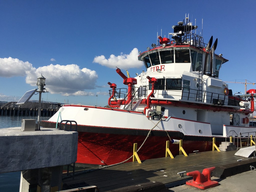 Firefighting vessel, painted red and white, that can enhance fire suppression effectiveness with SFS products